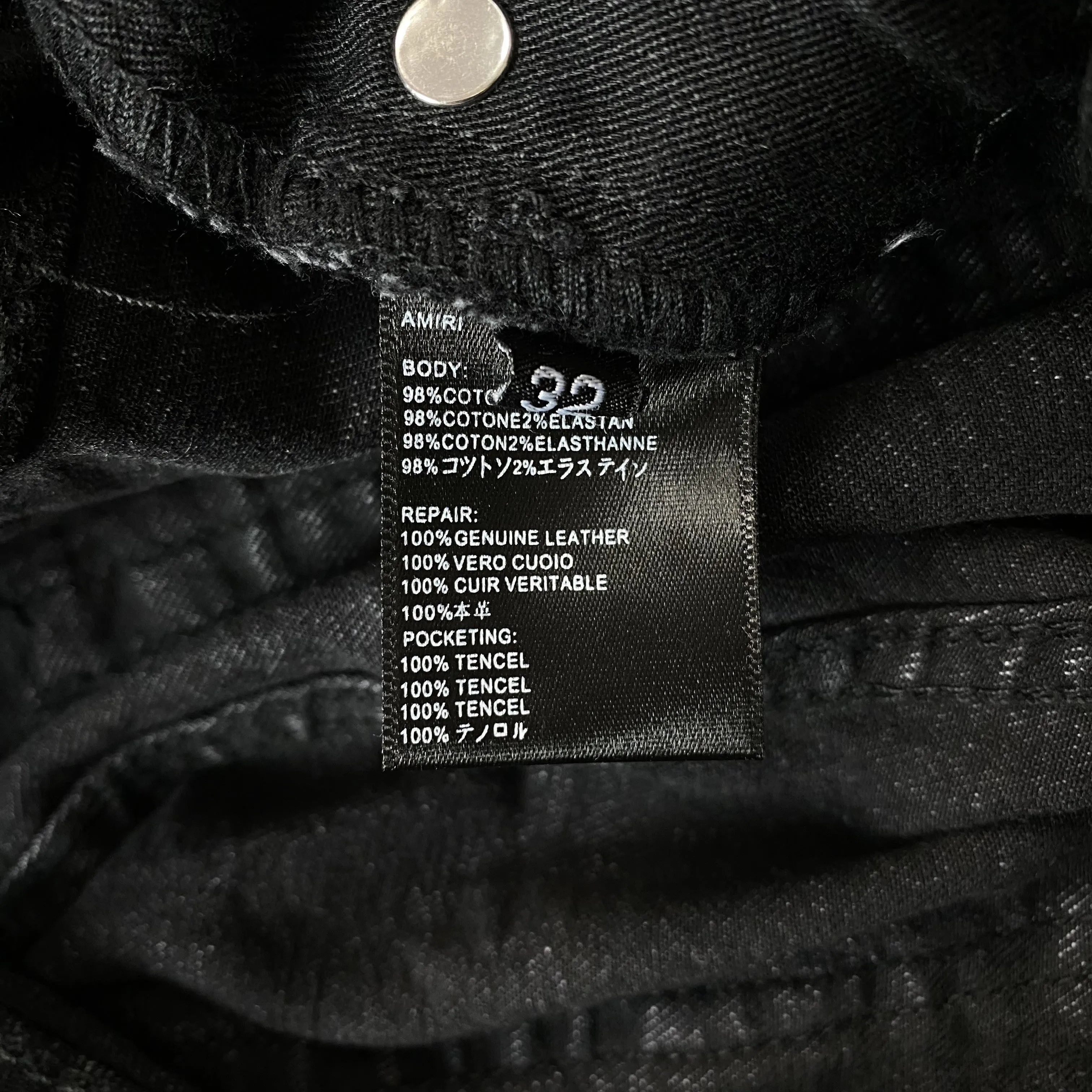 AMIRI VARSITY LOGO REPAIR JEANS