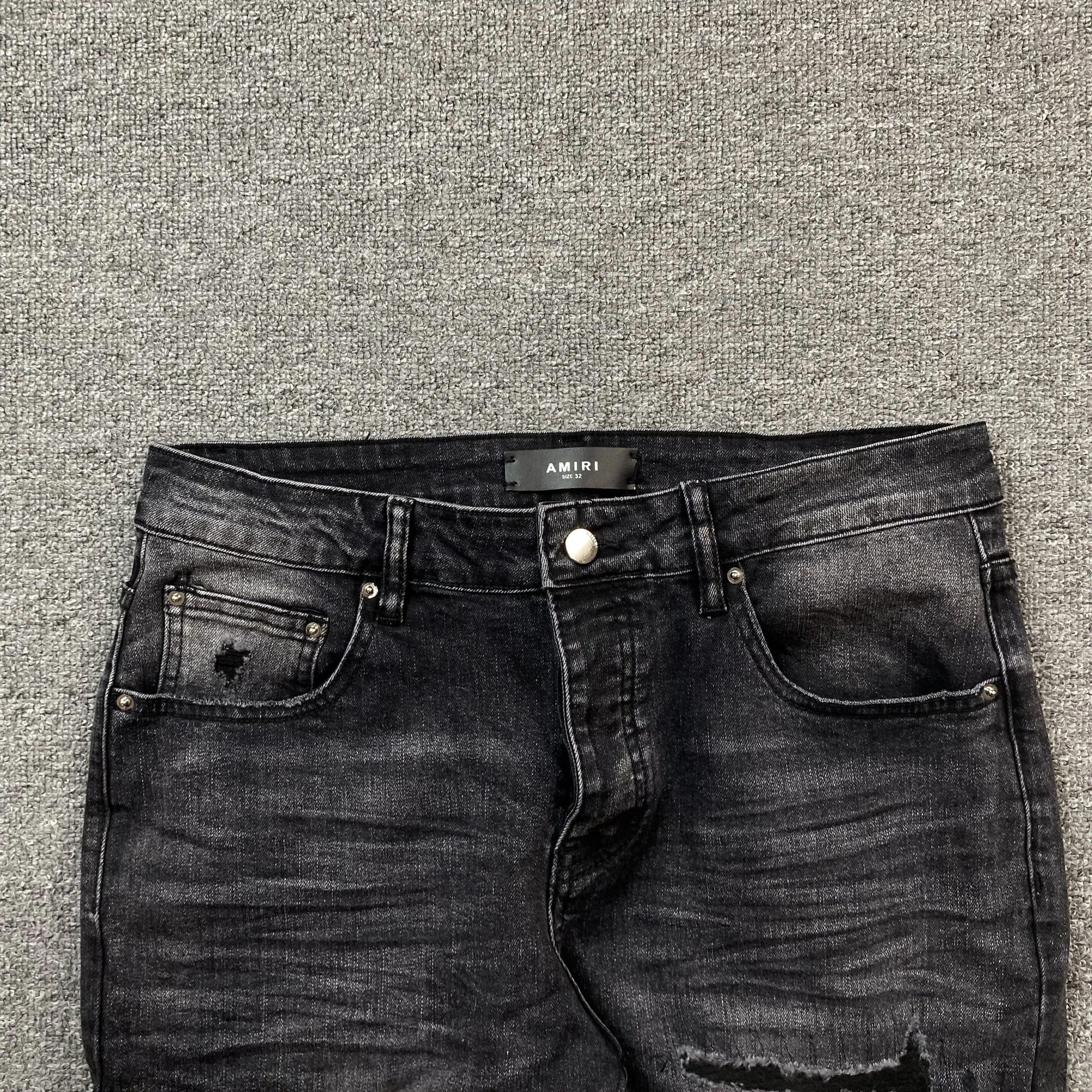 AMIRI VARSITY LOGO REPAIR JEANS